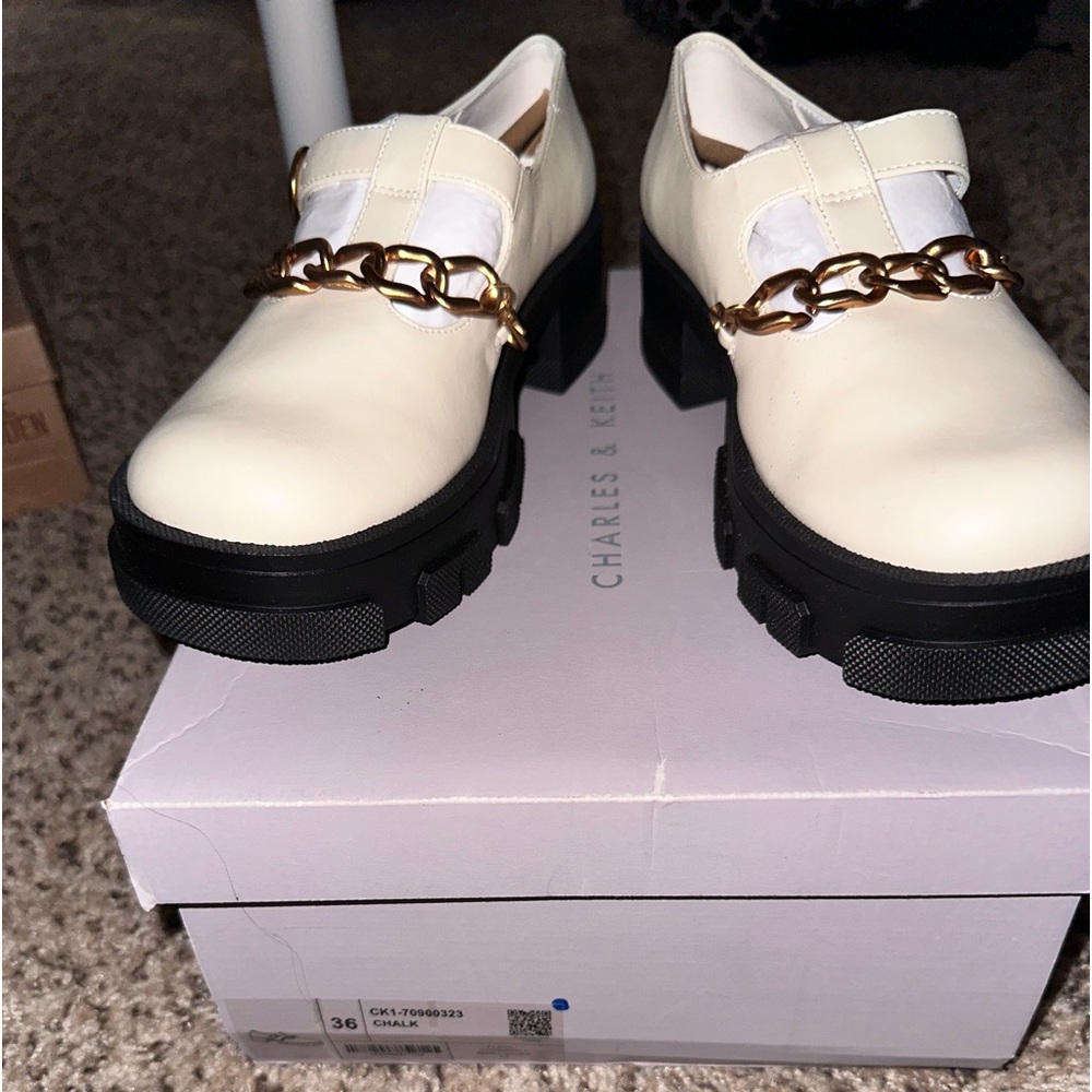 CHARLES AND KEITH- Mary Janes. Still in the box and never been worn. Size 36